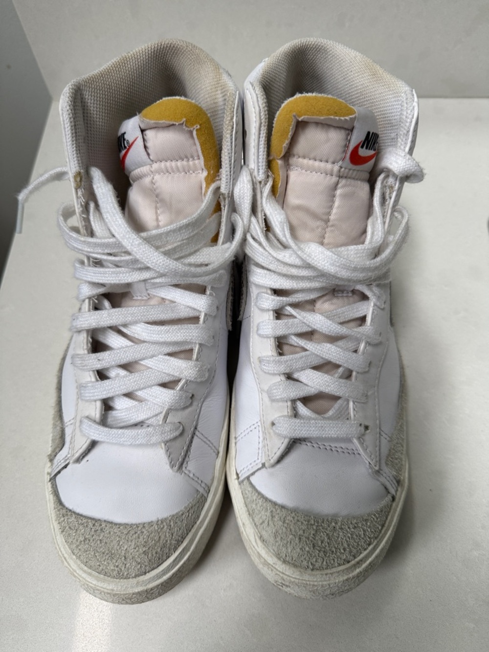 Nike White High-Top Sneakers with Yellow Tongue and Red Logo